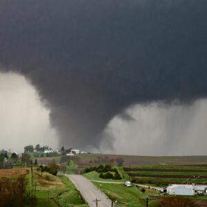 Picture of a Tornado picture over open farm fields.