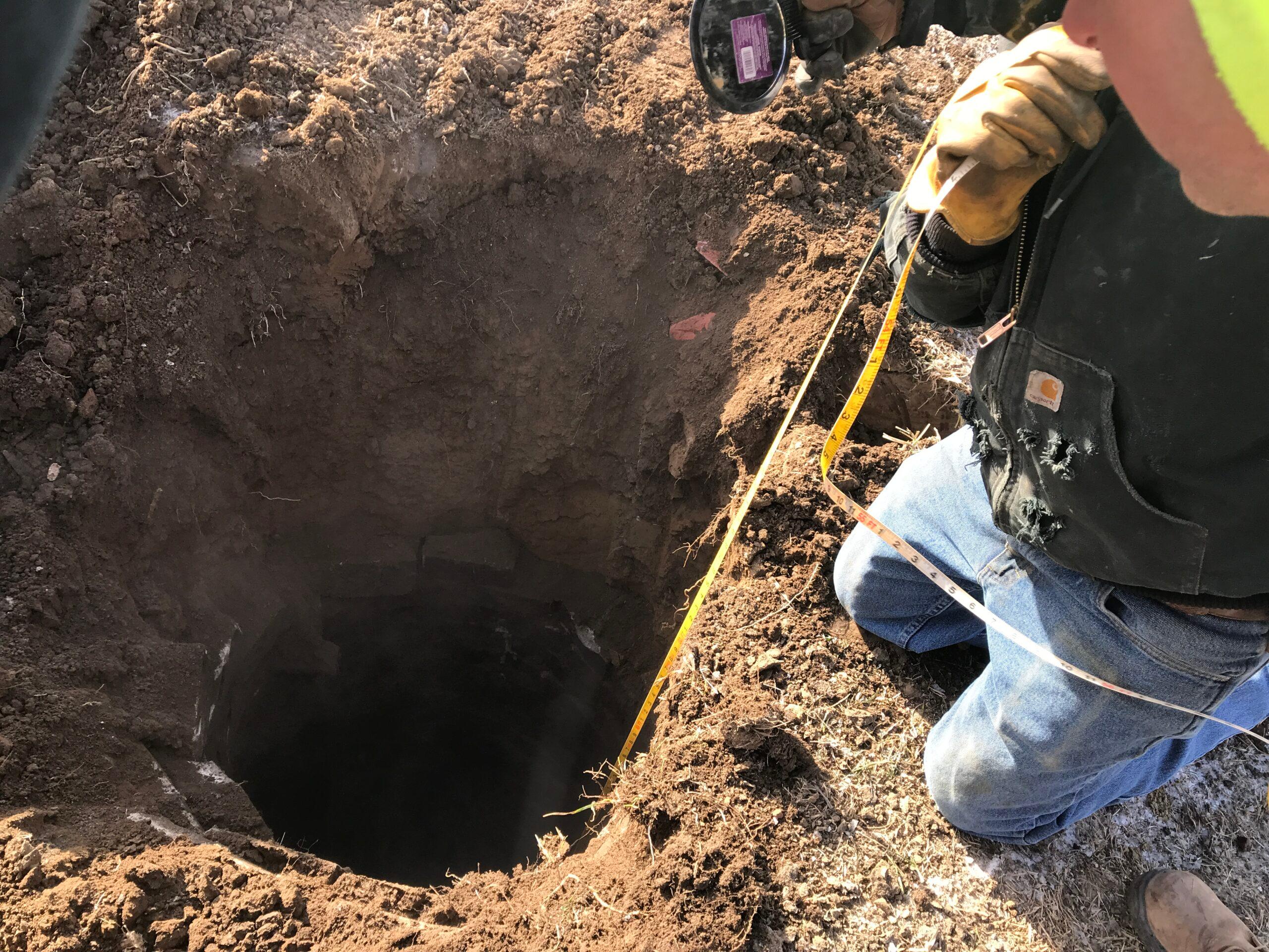 Papio NRD employee inspecting an unused water well.